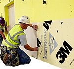 Air Vapor Barrier Being Applied by Construction Crew